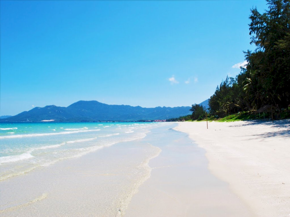 Once you arrive at the beach, you’ll be greeted by the sound of gentle waves and the natural beauty that surrounds the area